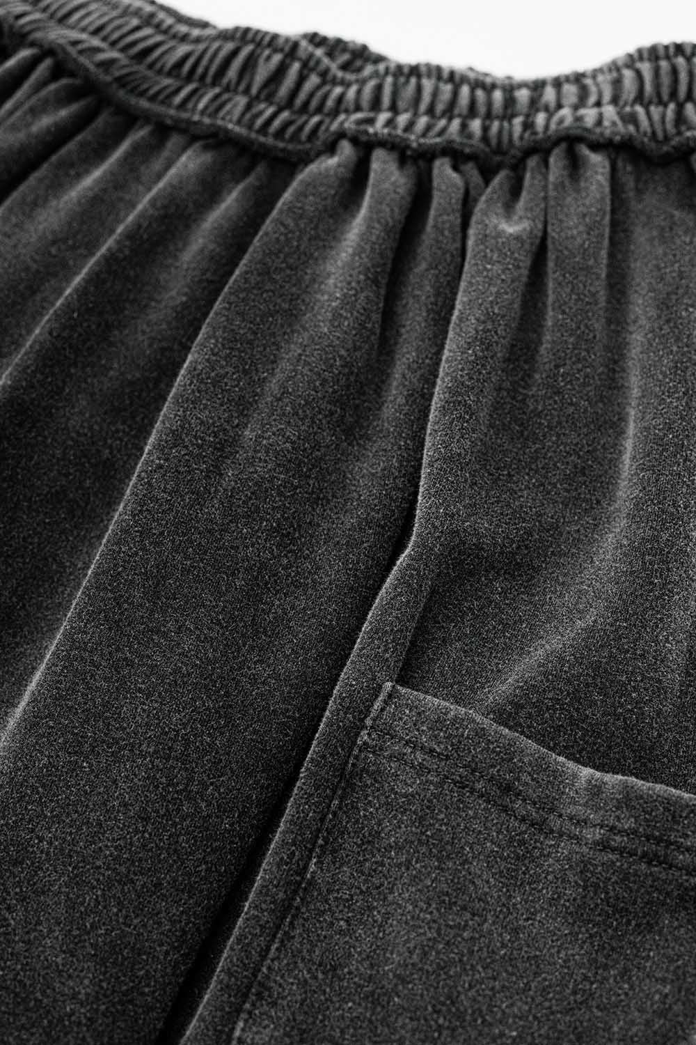 Calças jogger cinzentas com cintura elástica e bolso lateral