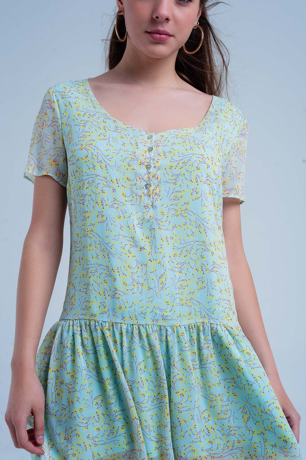 Vestido estampado verde com saia plissada