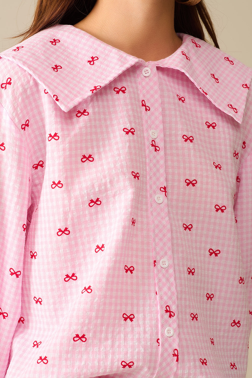 Blusa com Gola Peter Pan em Gingham Rosa com Estampa de Laço