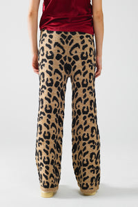 Calças com estampado de leopardo com malha elástica e pormenor de cordão