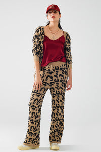 Calças com estampado de leopardo com malha elástica e pormenor de cordão