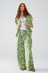 Calças de cintura elástica de perna larga com estampado floral verde