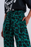 Calças de fundo largo em verde leopardo