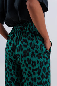 Calças de fundo largo em verde leopardo