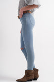Calças de ganga azul skinny com rasgões nos joelhos