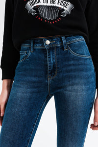 Calças de ganga skinny azuis médias lavadas com alta elevação
