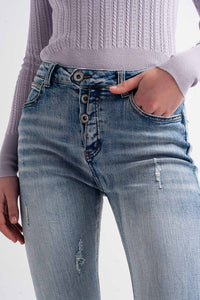 Calças de ganga skinny com detalhes de botões em azul claro