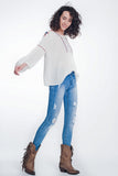 Calças de ganga skinny com lavagem vintage e rasgos marcados