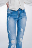 Calças de ganga skinny com lavagem vintage e rasgos marcados