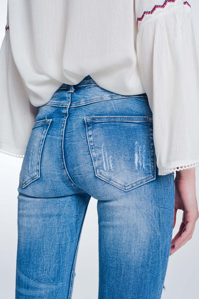 Calças de ganga skinny com lavagem vintage e rasgos marcados