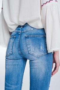 Calças de ganga skinny com lavagem vintage e rasgos marcados