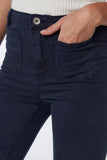 Calças de ganga skinny com pormenor de bolso à frente