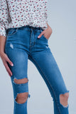 Calças de ganga skinny com rasgos muito desgastados