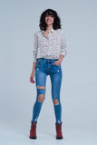 Calças de ganga skinny com rasgos muito desgastados