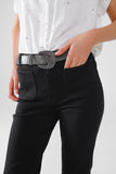 Calças de ganga skinny pretas com pormenor de bolso à frente