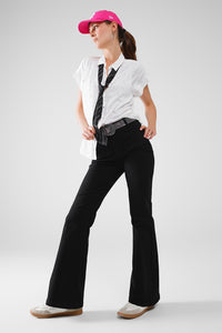 Calças de ganga skinny pretas com pormenor de bolso à frente
