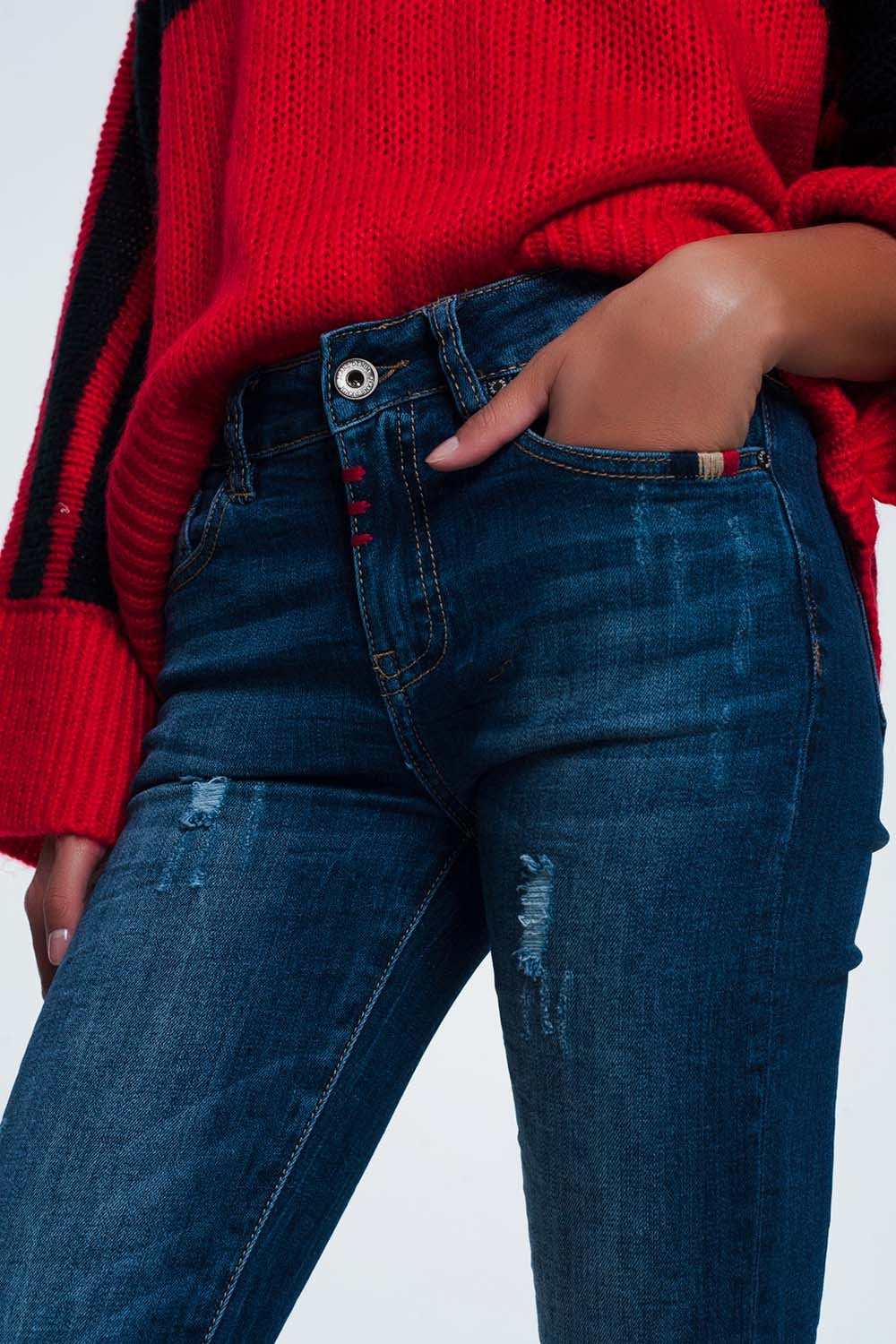 Calças de ganga slim com detalhe em fio colorido