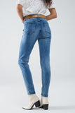 Calças de ganga super skinny esticadas em MIdwash com pormenores de desgaste