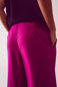Calças de perna larga plissadas em fuchsia