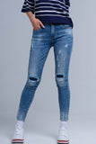 Calças jeans skinny com rips