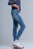 Calças jeans skinny com rips