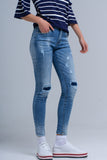 Calças jeans skinny com rips