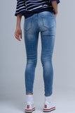 Calças jeans skinny com rips