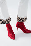 Calças largas de bombazina creme com estampado de leopardo na parte inferior