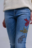 Calças skinny bordadas