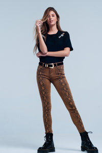 Calças skinny laranja em serpente