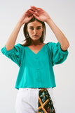 Q2 Camisa cropped com botões em verde