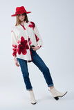 Camisa descontraída em bege com estampado de flores tropicais em vermelho