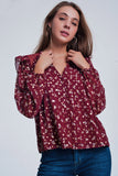 Camisa estampada marrom com babados nos ombros