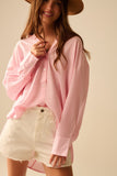 camisa rosa bebé de grandes dimensões com laço nas costas