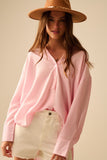 camisa rosa bebé de grandes dimensões com laço nas costas
