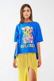 Q2 camiseta azul folgada com urso colorido