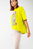 Camiseta lime folgada com urso colorido