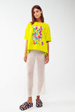 Camiseta lime folgada com urso colorido