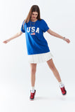 Camiseta longa azul solta com logotipo dos USA