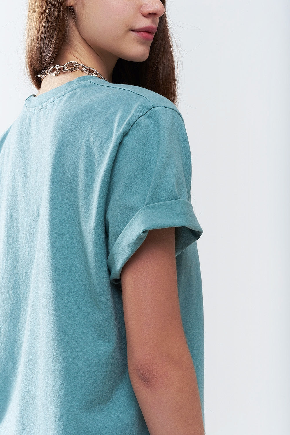 Camiseta longa solta verde com logotipo dos USA