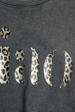 Camiseta preta relaxada stonewashed com Ciao em estampa de leopardo