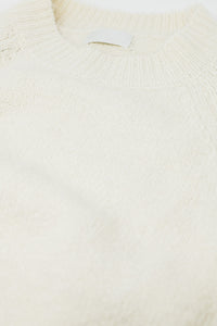 Camisola básica de malha com gola redonda em cor creme