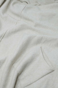 Camisola bege de grandes dimensões com bolsos à frente