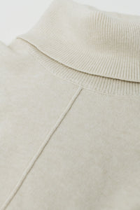 Camisola de gola alta bege com costura à frente