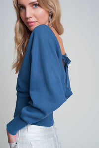 Camisola de malha com gola em V envolvida em azul