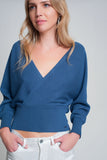 Camisola de malha com gola em V envolvida em azul