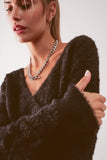 Camisola de malha fofa v pescoço em preto