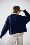 Camisola de malha macia em azul-marinho com mangas em balão
