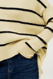 Camisola grande de cor creme com riscas pretas