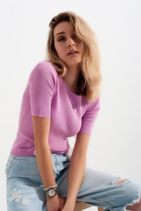 Camisola rosa trabalhada com nó nas costas